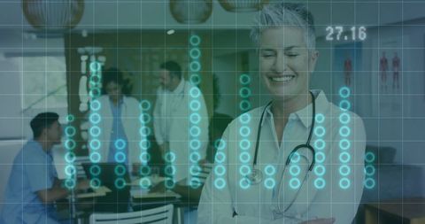 Confident Senior Doctor Collaborating with Team in Modern Conference