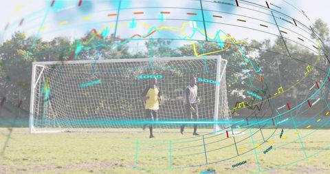 Goalkeepers training with augmented data overlay showing performance metrics and teamwork