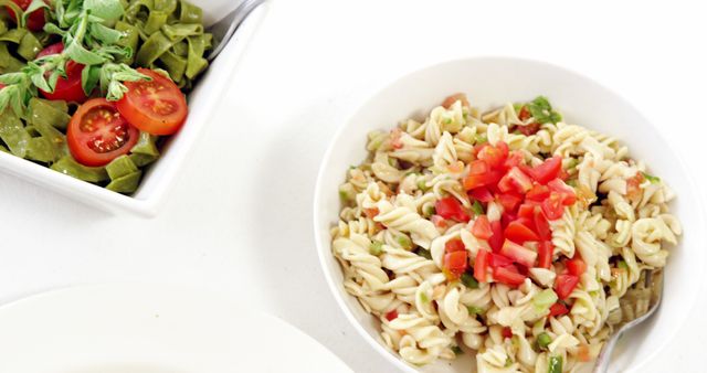 Healthy Lunch with Veggie Pasta Salad and Fresh Tomato Topping - Download Free Stock Images Pikwizard.com