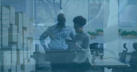 Team collaboration in modern office space with tablet