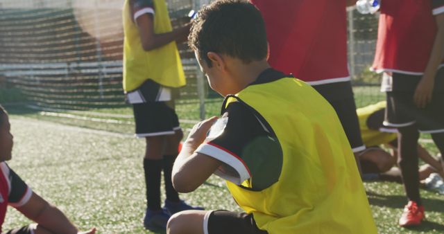 Youth Soccer Team Preparing for Practice on Sunny Day - Download Free Stock Images Pikwizard.com