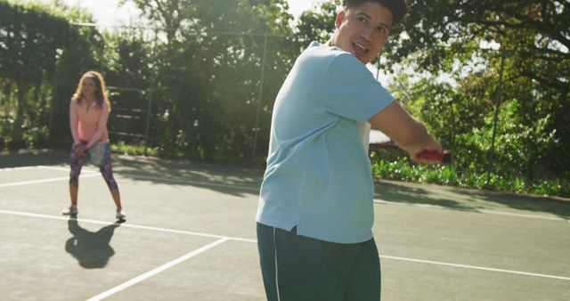 Friends Playing Tennis on Sunny Day - Download Free Stock Images Pikwizard.com