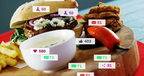 Gourmet blue cheese burger with pickled onion on wooden board with social media badges