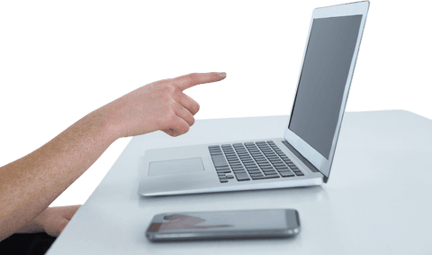 Businesswoman Gesturing at Laptop Screen, Transparent Smartphone in Foreground - Download Free Stock Videos Pikwizard.com
