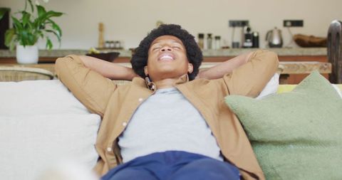 Relaxed African American Man Enjoying Leisure Time at Home - Download Free Stock Images Pikwizard.com