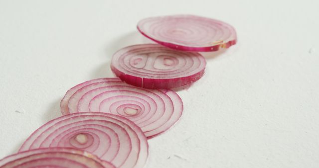 Freshly Sliced Red Onion Rings on White Surface - Download Free Stock Images Pikwizard.com