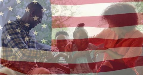 Family celebrating togetherness with American flag overlay in cozy living room