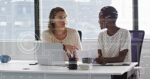 Mid Adult Professionals Collaborating in Modern Office Environment