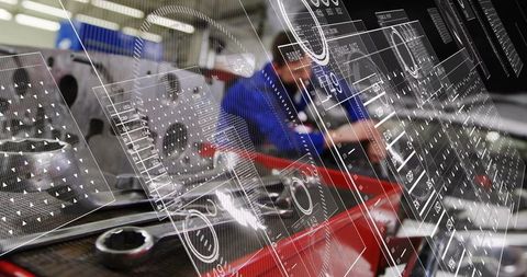 Mechanic repairing engine using augmented reality schematics and digital HUD overlays
