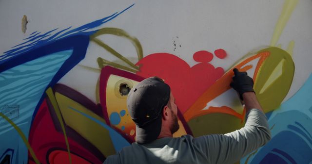 Artist Creating Colorful Graffiti on Wall - Download Free Stock Images Pikwizard.com