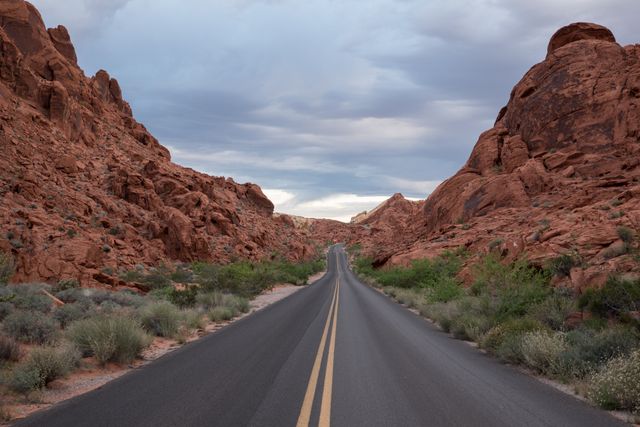 Empty Road Winding Through Rocky Desert Landscape - Download Free Stock Photos Pikwizard.com