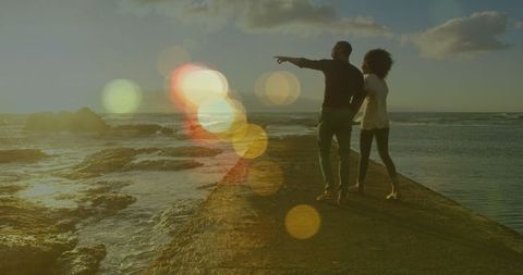 Carefree Romantic Couple Walking on Coastline