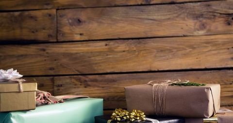 Assorted gift boxes on rustic wooden background