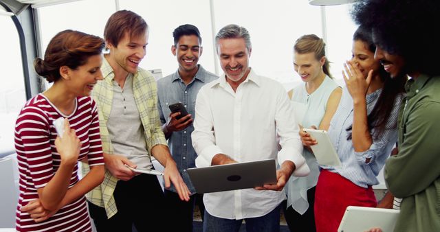 Diverse Colleagues Collaborating and Smiling in Office Setting - Download Free Stock Images Pikwizard.com