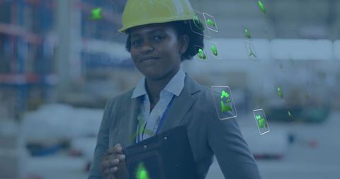 Engineer Inspecting Warehouse Inventory Using AR Tablet and Digital Safety Overlay