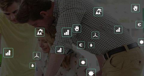 Collaborative team leaning over laptop reviewing sustainability dashboards and energy data