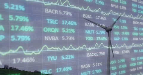 Financial Data Overlaying Spinning Wind Turbine Symbolizing Green Economy