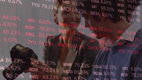 Office Team Reviewing Photos Through Financial Lens Overlay