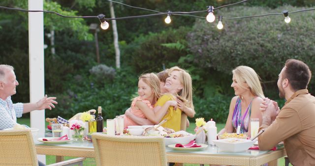 Happy Family Enjoying Outdoor Dining, Gathered Around Table - Download Free Stock Images Pikwizard.com