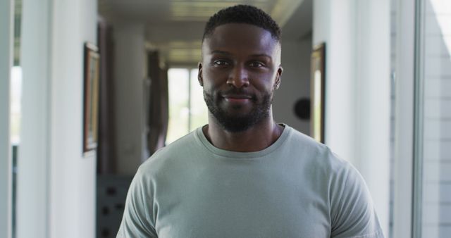 Confident Man Standing Indoors in Casual Wear - Download Free Stock Images Pikwizard.com