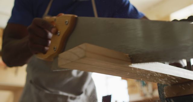 Close-up of Carpenter Cutting Wood with Hand Saw - Download Free Stock Images Pikwizard.com