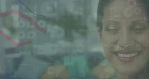 Smiling Businesswoman With Overlay of Financial Data Analytics