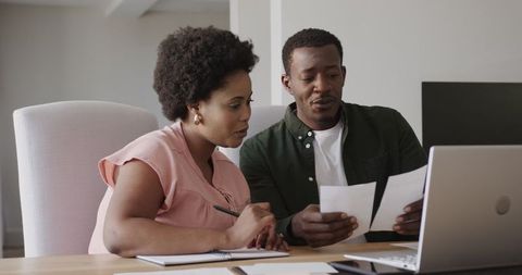 African American Friends Discussing Project at Home