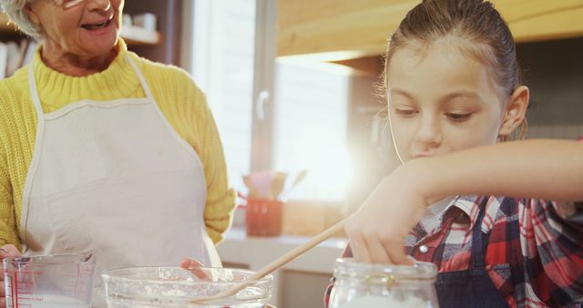 Grandmother Teaching Granddaughter Baking in Cozy Kitchen - Download Free Stock Images Pikwizard.com