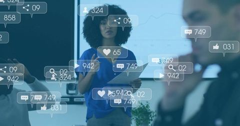 Woman presenting with social media engagement overlays during office meeting