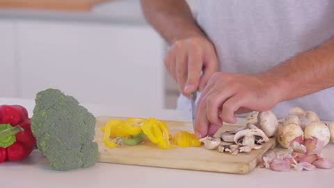 Person Chopping Vegetables for Fresh Homemade Salad