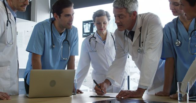 Medical Team Collaborating on Patient Diagnosis in Hospital Conference Room - Download Free Stock Images Pikwizard.com