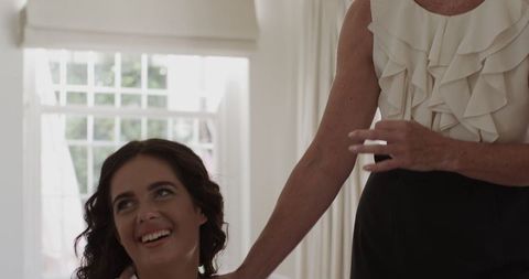 Bride Smiling While Getting Ready for Wedding Ceremony