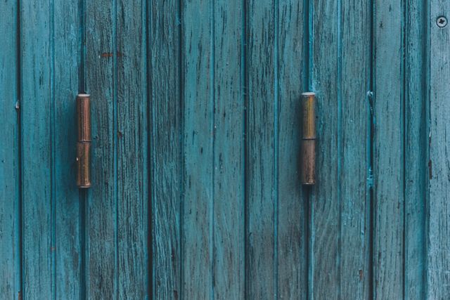 Close-Up of Weathered Blue Wooden Door with Metal Handles - Download Free Stock Photos Pikwizard.com