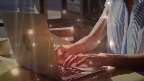Hands Typing on Laptop with Virtual Network Overlay in Cafeteria