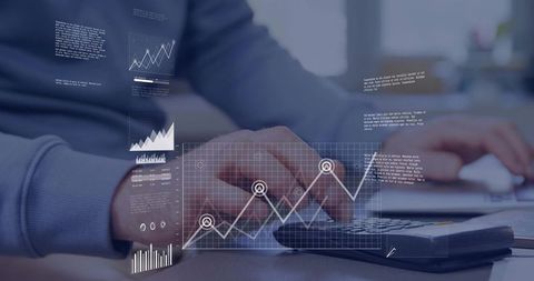 Business analyst typing and visualizing holographic financial charts and data analytics