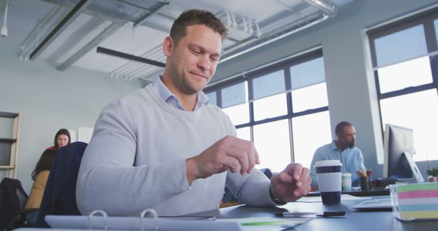 Professional Man Working at Modern Office Desk with Colleagues - Download Free Stock Images Pikwizard.com