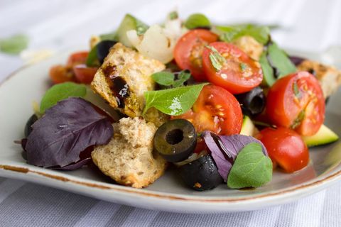 Rustic Panzanella Salad Featuring Cherry Tomatoes, Black Olives, Croutons and Fresh Basil