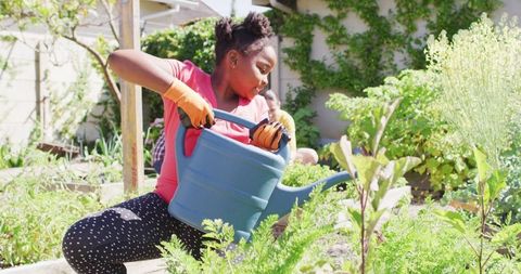 Mother and Daughter Enjoying Family Gardening Activity Together