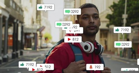 Urban indian man wearing headphones and backpack surrounded by social media notifications