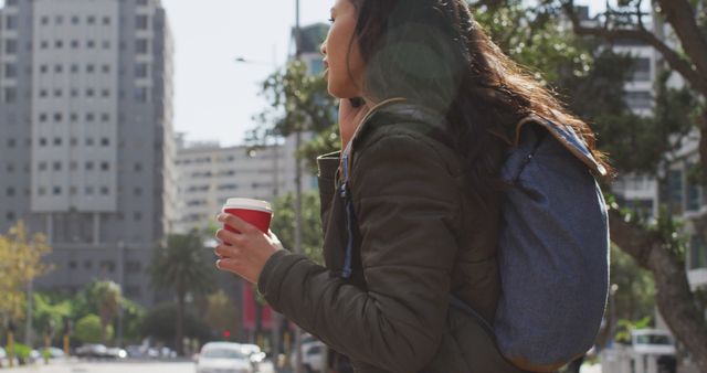 Urban Traveler Woman Holding Coffee Cup Walking on City Street - Download Free Stock Images Pikwizard.com