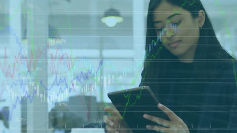 Businesswoman Analyzing Financial Data on Tablet with Digital Graph Overlay