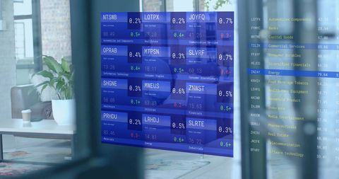 Business Investor Analyzing Stock Market Data in Office