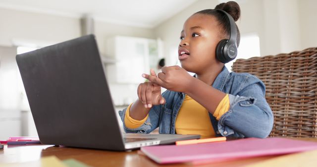 Girl Learning Online with Laptop and Headphones, Focused on Writing - Download Free Stock Images Pikwizard.com