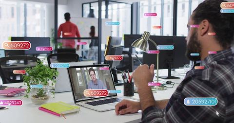Office Workspace with Virtual Meeting and Data Visualization