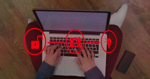 Hands Typing on Laptop Highlighting Cybersecurity Measures
