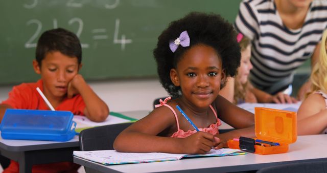 Smiling Young Girl in Classroom with Other Students - Download Free Stock Images Pikwizard.com