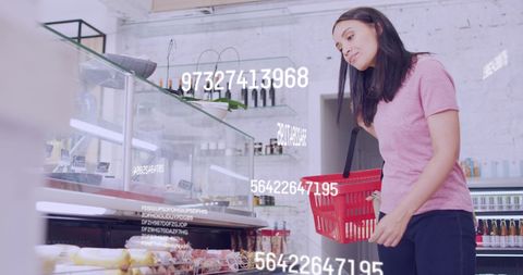 Woman Analyzing Pricing Data While Shopping in Grocery Store