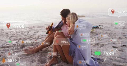 Couple Relaxing at Beach with AR Icons at Dusk