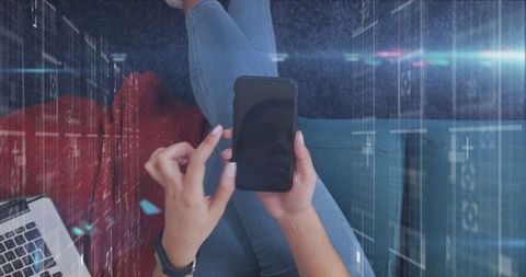 Woman Using Smartphone Amidst Holographic Digital Data Elements