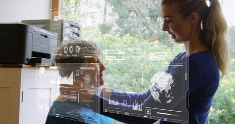 Caregiver assisting senior in home office with digital hud overlay technology and health data